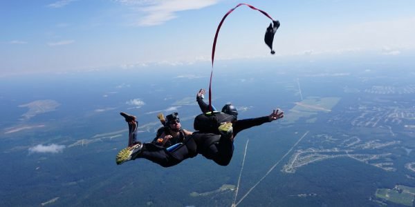 student deploys their own parachute during skydiving course