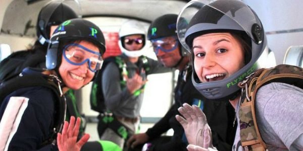inside of a skydiving plane full of jumpers