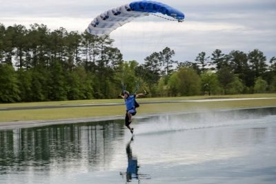 experienced skydiver lands into swoop pond