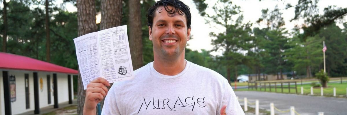 Paul holds up skydiving license