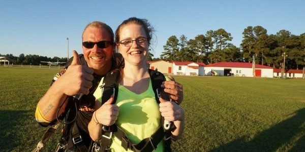 Heather Wolfe gives a thumbs up after landing from a skydive