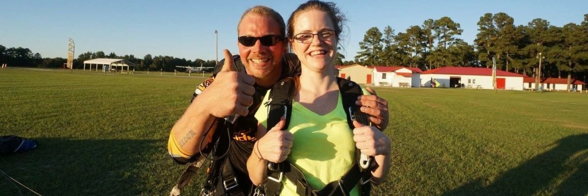 Heather Wolfe gives a thumbs up after landing from a skydive