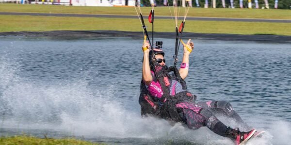 swooper Jeannie Bartholomew swooping pond during a canopy competition