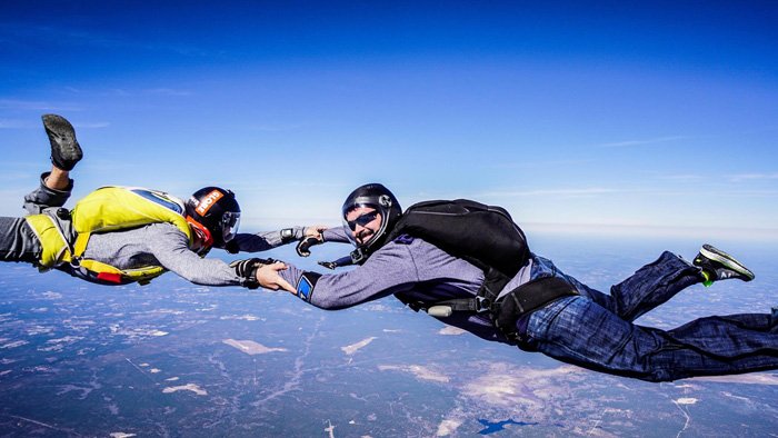 Skydivers in free fall during a-license certification