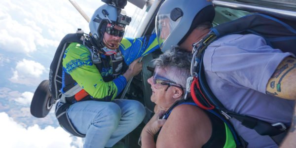 A skydiver prepares to jump from the plane.