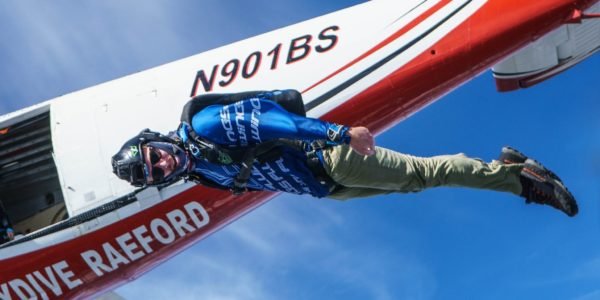 solo skydiver exits airplane into a flat track to prepare for a movement jump